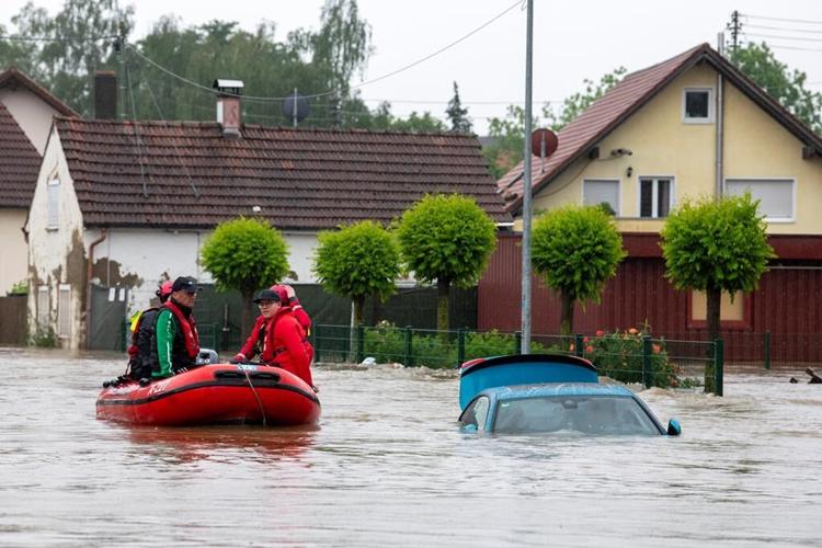 A firefighter dies and a long-distance train derails amid heavy rains and flooding in Germany
