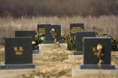 Migrants from Africa and Mideast who died in Bosnia get marble headstones and a memorial