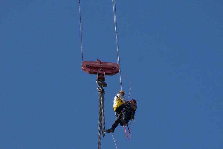 Fire teams rescue 15-year-old stuck on crane over high-rise building in Jerusalem