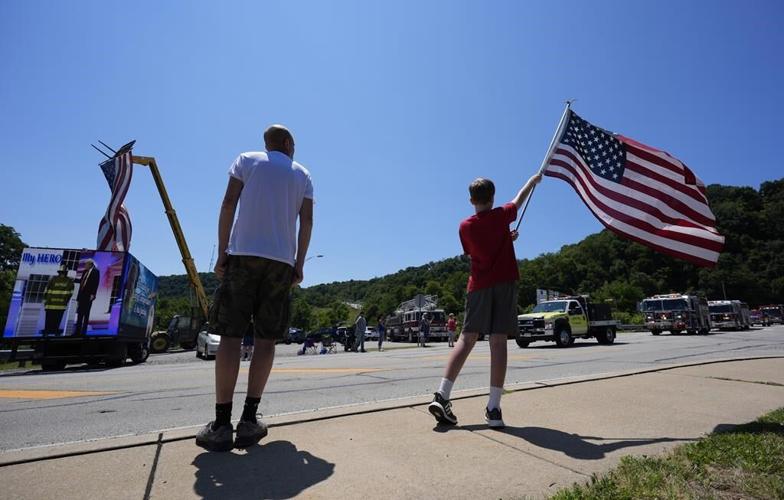 Firefighter killed at Trump rally honored with bagpipes, gun salute and a bugle sounding taps