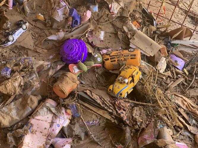 Libya seals off flooded city so searchers can look for 10,000 missing after death toll passes 11,000