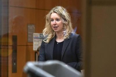 Elizabeth Holmes loses latest bid to avoid prison and gets hit with $452 million restitution bill