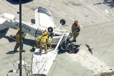 Small plane crashes in parking lot of Southern California auto store