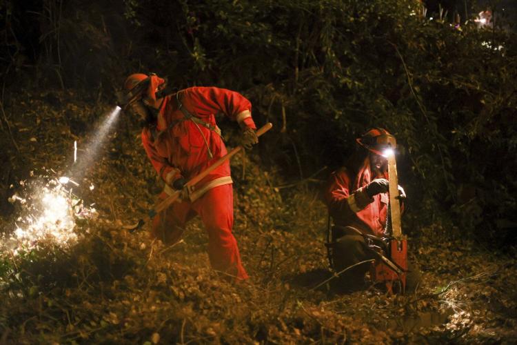 On LA fire lines, inmates shoulder heavy packs and tackle dangerous work for less than $30 a day