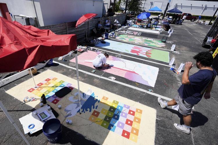 Parking spots used as colorful protest against Florida crackdown on rainbow crosswalks