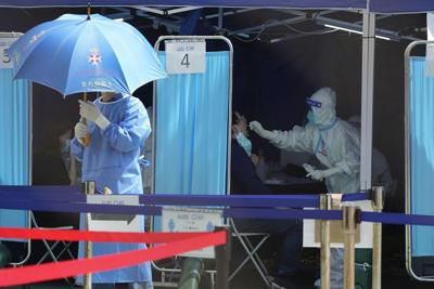 Hong Kong scraps vaccine pass, COVID-19 tests for travelers