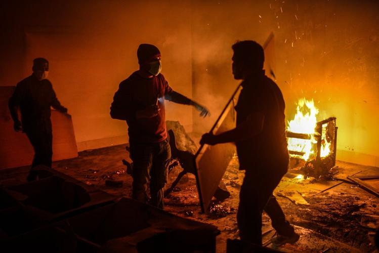 Bangladeshi protesters storm and destroy a house linked to exiled former Prime Minister Hasina