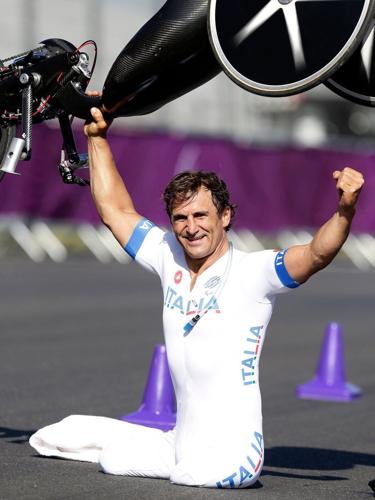 Alex Zanardi, auto racing champion who won Paralympic gold after life-altering accidents, dies at 59