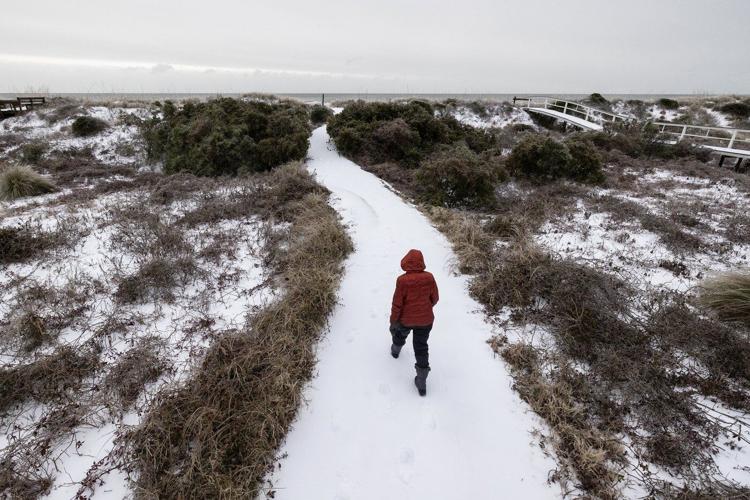 Winter storm spreads across the Deep South, creating icy danger and snowy fun