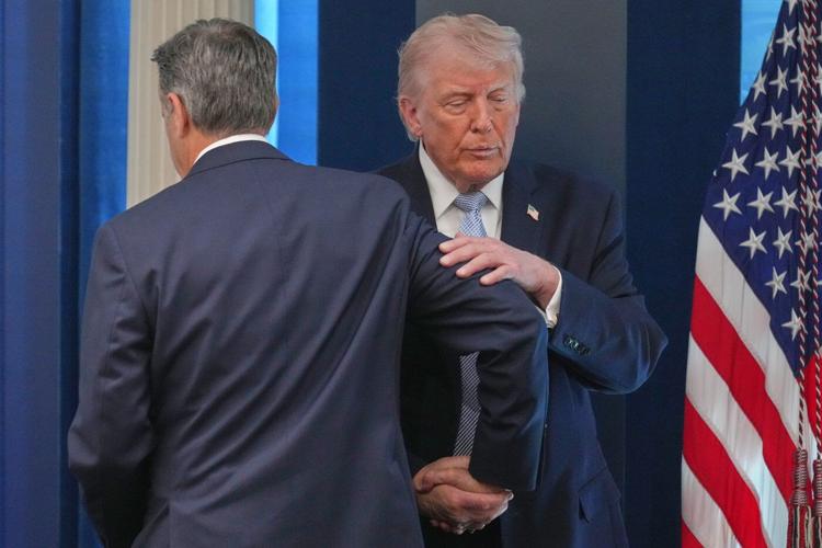 Photos of Trump's Monday, talking Iran at Easter Egg Roll and mimicking a sniper in the press room