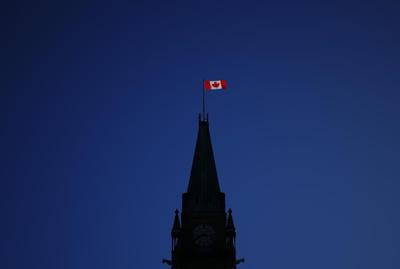 Different schools of thought on why Canada drapes itself with red and white
