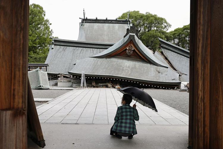 Rescuers search for the missing after Japan earthquake as death toll rises to 13