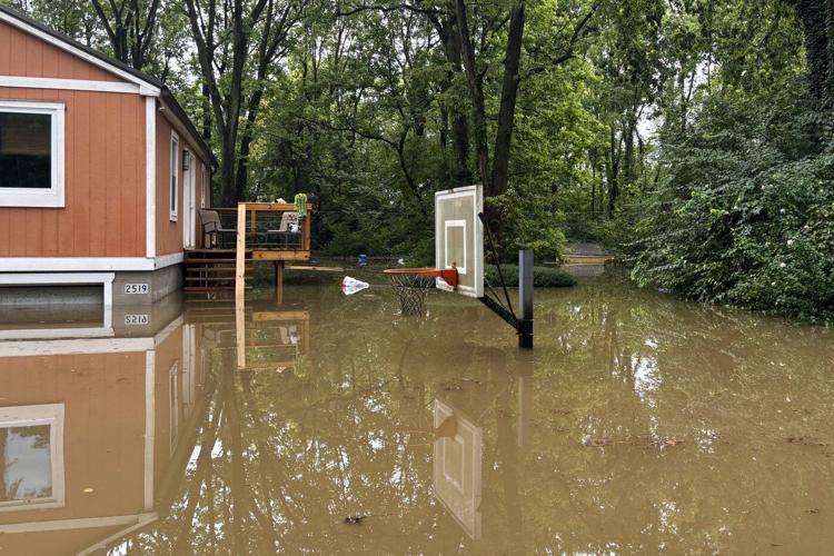 At least 6 people have died from days of storms and record-setting flooding in Indiana