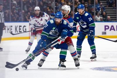Rangers trip Canucks 4-3 in overtime thriller