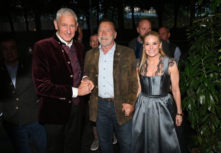 Schwarzenegger directs a band in a beer tent at Munich's Oktoberfest