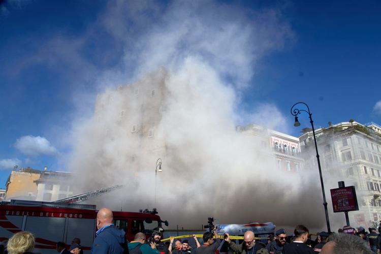 Rescuers work to reach worker trapped in medieval tower that partially collapsed in Rome