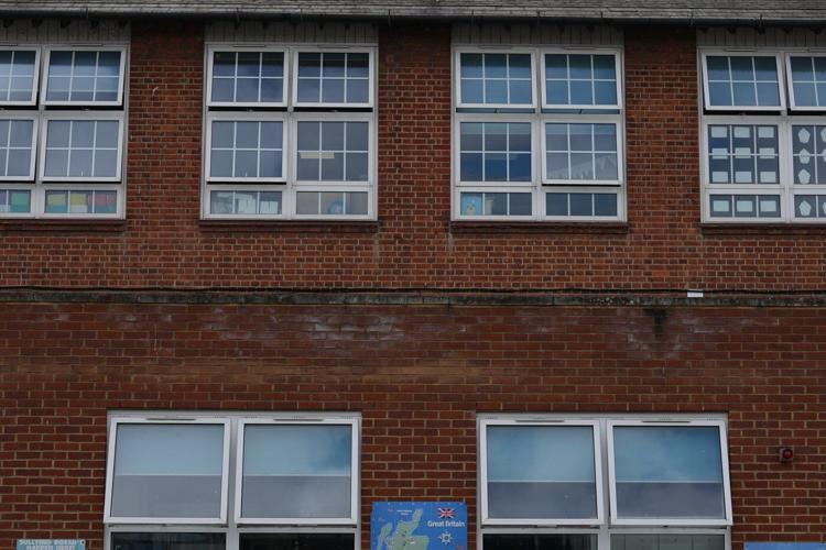 With poor ventilation and children packed in, UK's outdated schoolhouses swelter in the heat