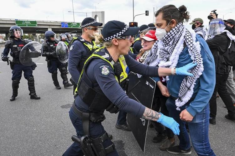 Anti-war protesters clash with police outside Australian arms convention