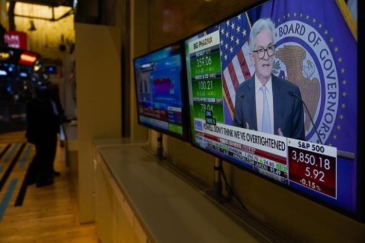 Stocks fall after Fed says rates may rise more than expected
