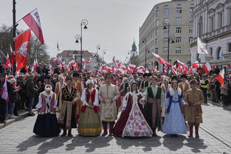 Poles celebrate coronation of 1st king at march supporting conservative presidential candidate