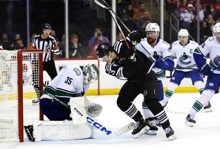 Miller, Pettersson score twice as Canucks burn Devils 6-4