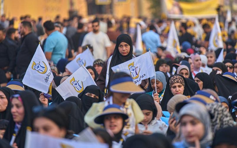 Photos show Iraqi security forces and displaced people voting early in parliamentary election