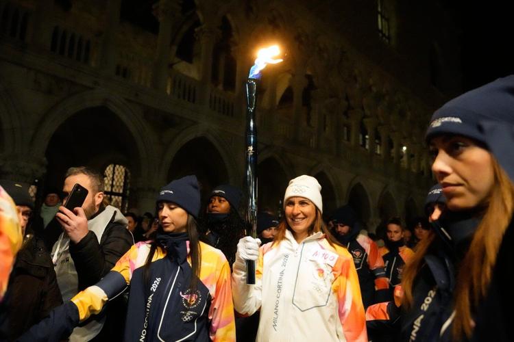 Olympic flame makes historic passage down Venice's Grand Canal