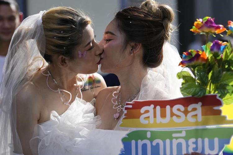 Lawmakers in Thailand overwhelmingly approve a bill to legalize same-sex marriage