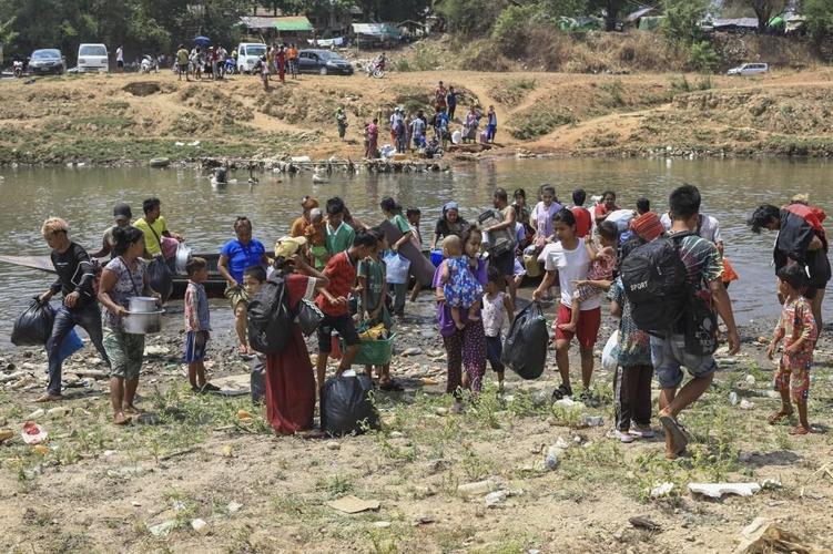 About 1,300 people from Myanmar flee into Thailand after clashes broke out in a key border town
