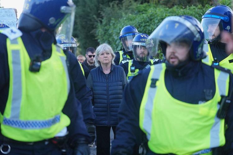 UK prosecutors say rocks and eggs thrown at police during asylum hotel protests