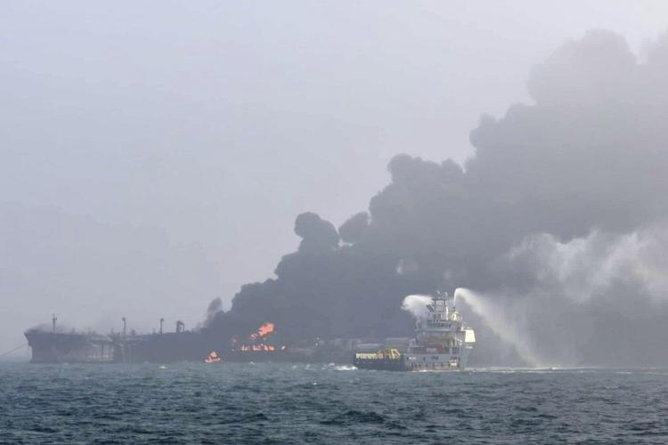 A cargo ship hits a tanker and they catch fire off England, with one crew member missing
