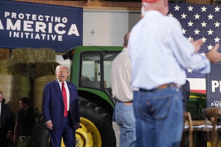 Trump listens during a farming event in rural Pennsylvania, then threatens John Deere with tariffs