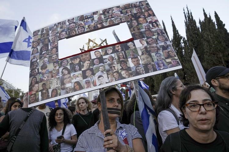 Patients and staff leave Gaza's biggest hospital as dozens are killed at a crowded refugee camp