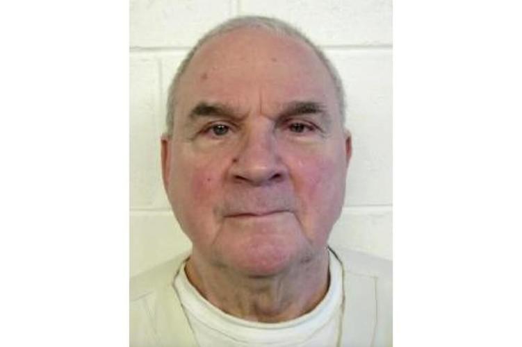 A rabbi serving 30 years to life in his wife's contract killing has died, prison officials say