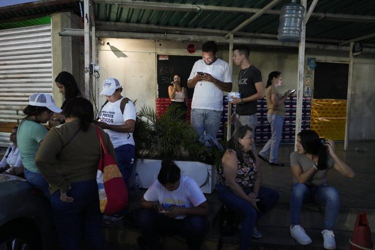 Photos show relatives waiting outside prisons as Venezuela frees a handful of detainees