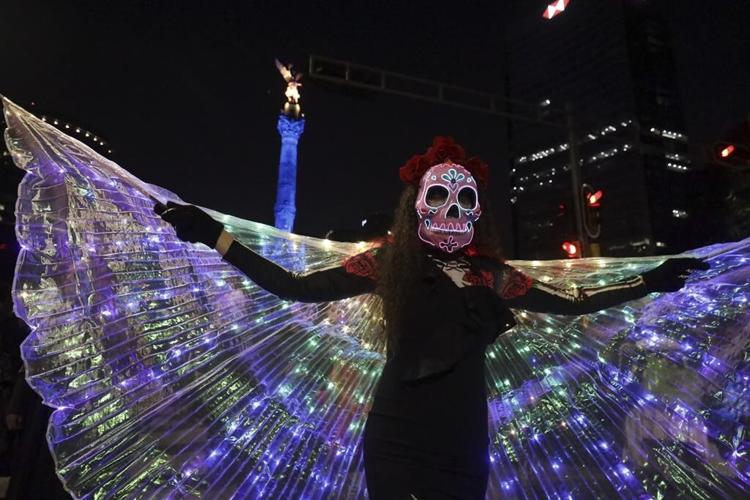 With flowers, altars and candles, Mexicans are honoring deceased relatives on the Day of the Dead