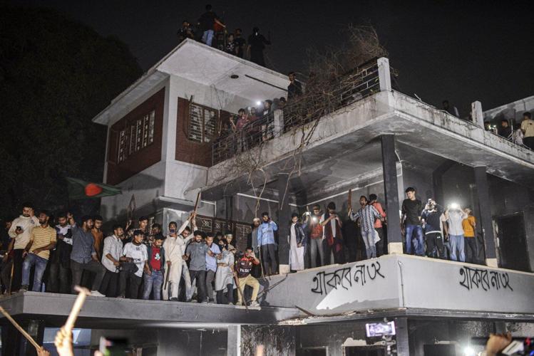 Bangladeshi protesters storm and destroy a house linked to exiled former Prime Minister Hasina