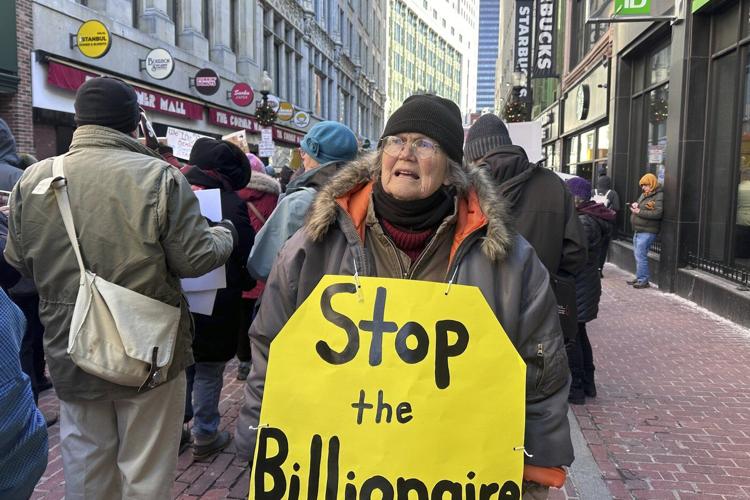 Hundreds march in Boston to support democracy and protest policies of Trump, Musk