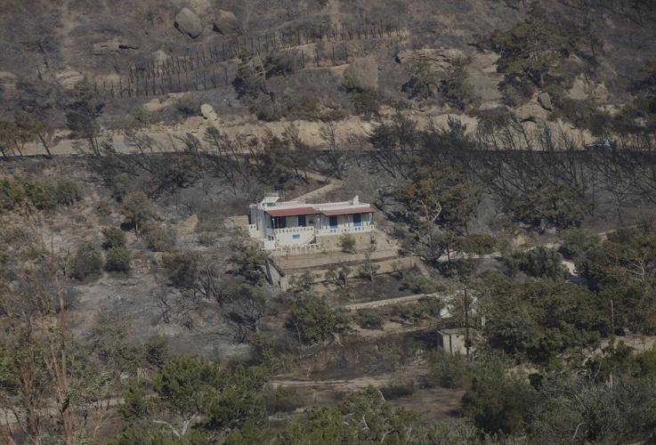 Firefighters race to contain wildfires in Greece as thousands evacuated, 2 die in Turkey