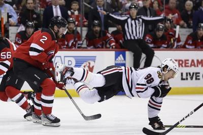 Blackhawks' Bedard leaves game against Devils after hit from Smith