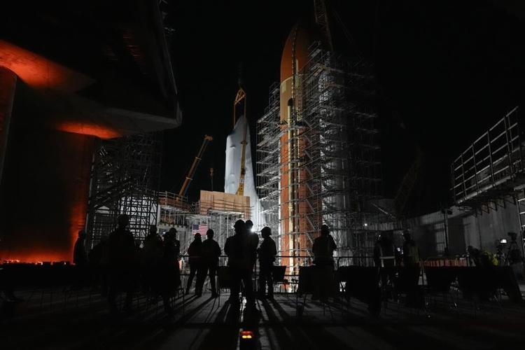 Space Shuttle Endeavour hoisted for installation in vertical display at Los Angeles science museum
