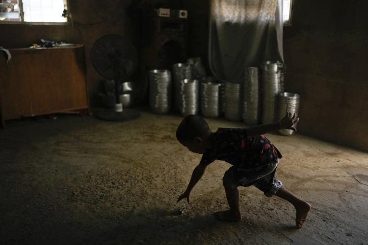 PHOTO ESSAY: Migrants returning to Venezuela face debt and harsh living conditions