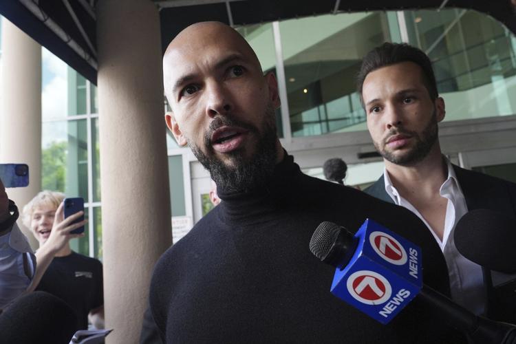 Influencer Tate brothers, who face human trafficking charges in Romania, arrive in the US