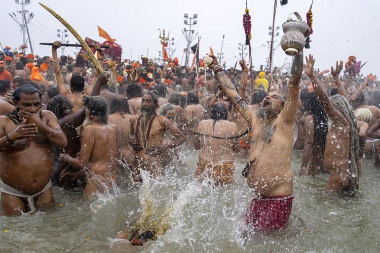 Millions of pilgrims and naked, ash-smeared ascetics take holy dips in India's mega Hindu festival