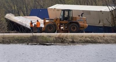 Containers secured to shore after Wisconsin train derailment