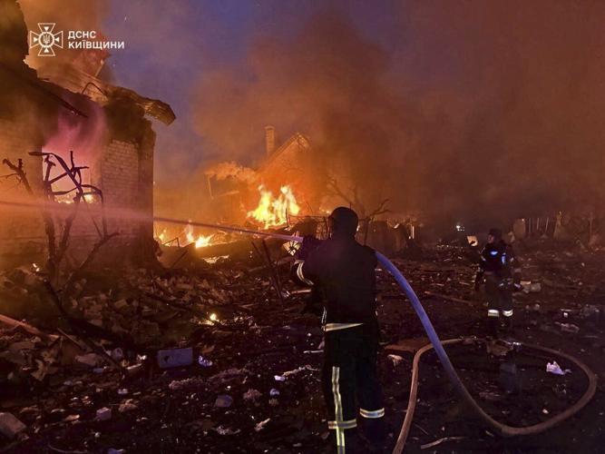 A massive Russian drone-and-missile attack on Ukraine kills at least 12 people, officials say
