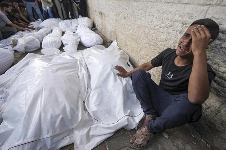 An Israeli airstrike kills 18 members of a family in Gaza as mediators hope for a cease-fire