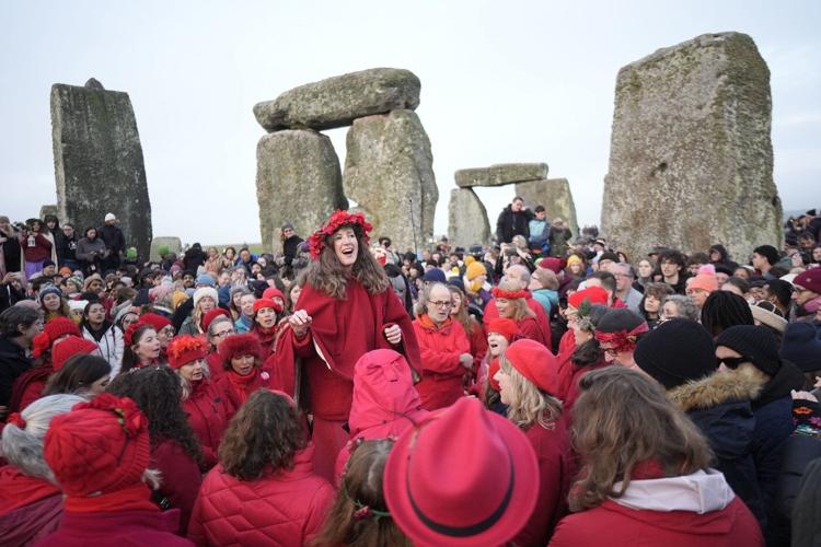 Thousands cheer as the sun rises on winter solstice at Stonehenge