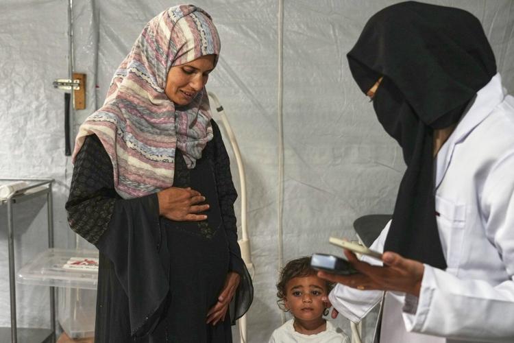 A pregnant woman under Israel's blockade in Gaza's ruins fears for her baby