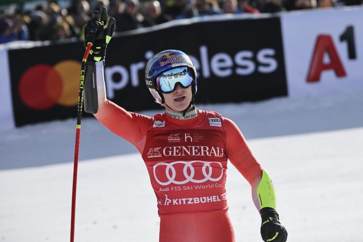 Swiss skier Marco Odermatt takes eventful World Cup super-G for 1st win in Kitzbuehel